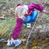 E8700-20041229-DSCN0878  Alison plays in the creek with ice at Dad's house : 2004, Alison, Christmas