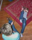 E8700-20071123-DSCN4627  Thanksgiving 2007 at the Mull's house.  Lois uses the cat toy on Alison : 2007, Alison Mull, Lois, Thanksgiving