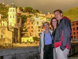 Sun Through the Storm  Lois, Teresa, and Hal pose by the harbor on a stormy day in Vernazza Italy : 2004, Cinqa Terra, Hal, Italy, Lois, Teresa, Vernazza