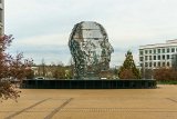 Big Head Profile  Metalmorphosis is a mirrored water fountain by Czech sculptor David Černý that was constructed at the Whitehall Technology Park in Charlotte, NC. The 14-ton sculpture is made from massive stainless steel layers that rotate 360 degrees and occasionally align to create a massive head. It even has it’s own live webcam.   3701 Arco Corporate Dr Charlotte, NC 28273 : Big Head, Charlotte, Metalmorphosis