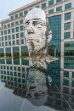 Metalphorosis Study  Metalmorphosis is a mirrored water fountain by Czech sculptor David Černý that was constructed at the Whitehall Technology Park in Charlotte, NC. The 14-ton sculpture is made from massive stainless steel layers that rotate 360 degrees and occasionally align to create a massive head. It even has it’s own live webcam.   3701 Arco Corporate Dr Charlotte, NC 28273 : Big Head, Charlotte, Metalmorphosis