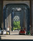 ILCE-6000-20180512-DSC04108  Freemont statues The Freemont Troll (The Troll Uner The Bridge) Built in 1989, conceived as a way to revitalize the area under the Aurora Bridge, which had fallen derelict to the use of drug dealers. The street right in front of was renamed Troll Avenue in 2005. Depicts a large troll holding tightly onto a real Volkswagen Beetle.  Designed by four local artists. : 2018, Freemont, Seattle, The Freemont Troll, The Troll Under The Bridge, buildings & architecture